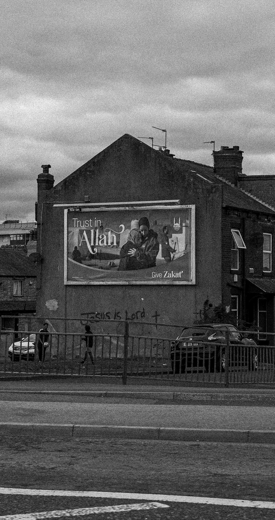 Black and white mural on a terrace gable end, Leeds
